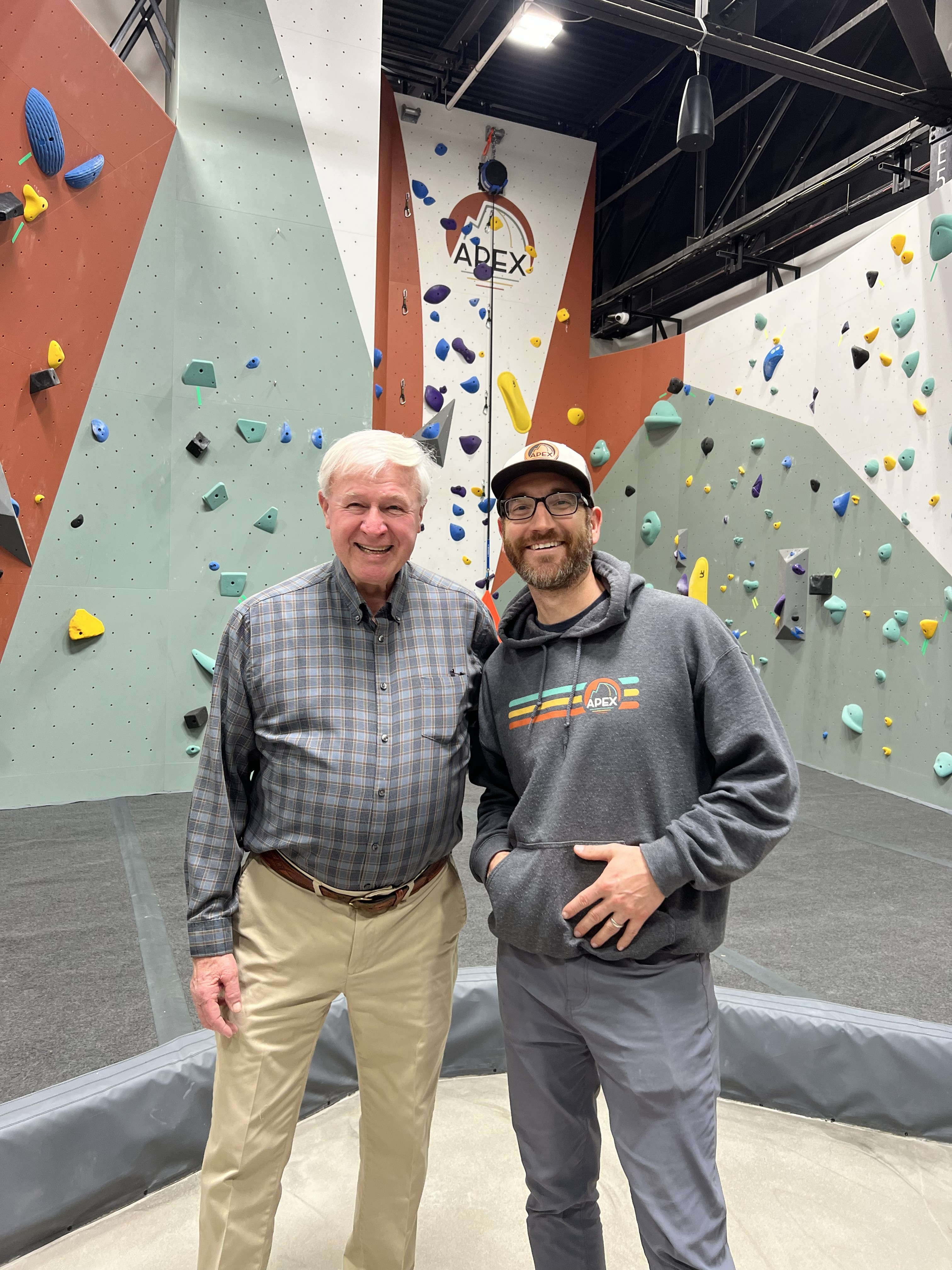 APEX owner Phillip Blume (right) is pictured with Mike Rivers in front of a climbing wall at APEX Climbing & Spa. Rivers played a key role in Blume’s rock climbing background, serving as a mentor throughout Blume’s childhood. (Submitted Photo)