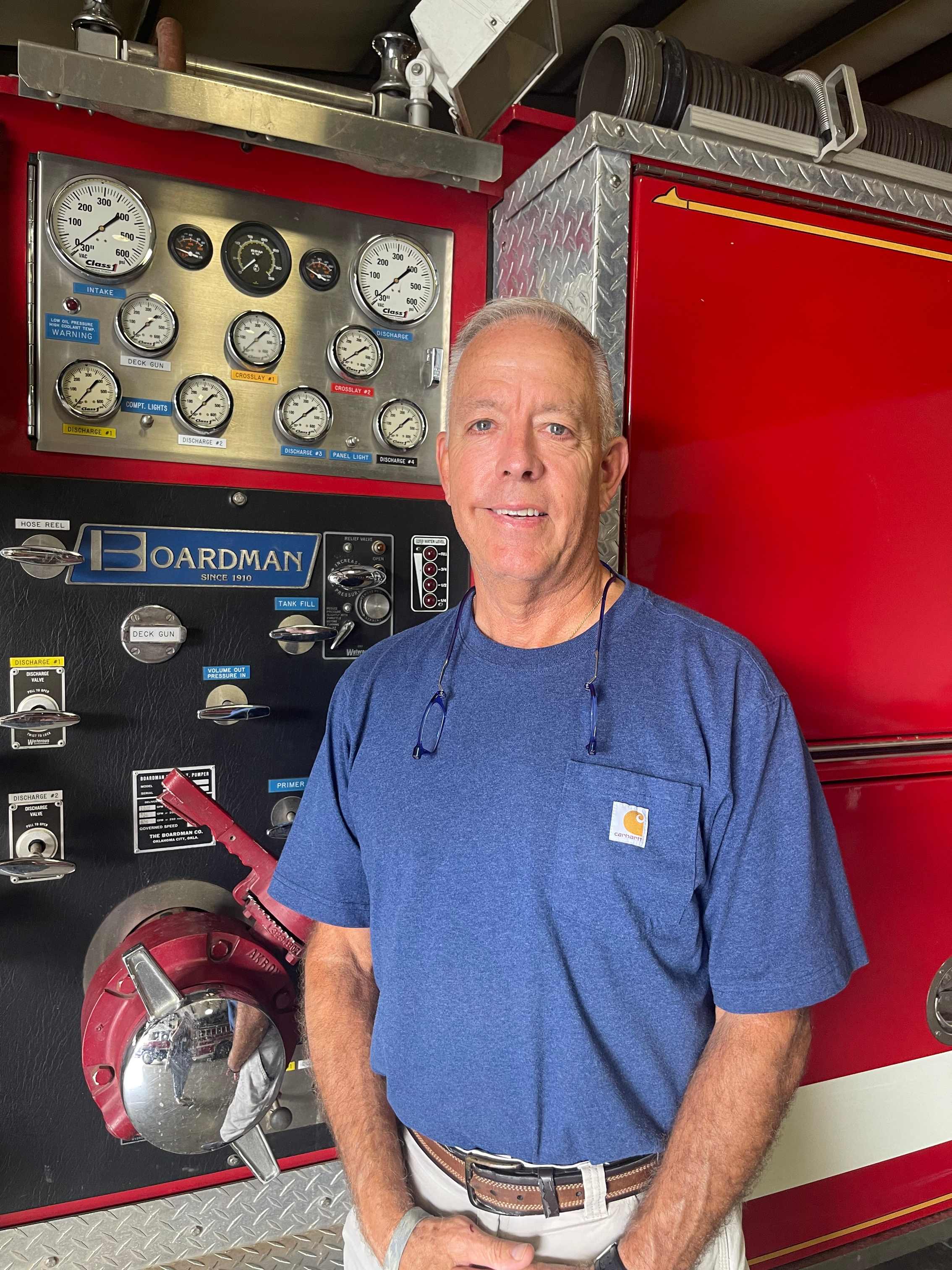 Rocky Miller, the chief of Oglethorpe County Fire and Rescue (OCFR), stands in front of a truck at the Crawford Volunteer Fire Department. OCFR is one of the consolidated groups of fire departments, consisting of the Crawford, Sandy Cross, Devils Pond, Pleasant Hill and Wolfskin stations. (Lexie Shadix/The Oglethorpe Echo)