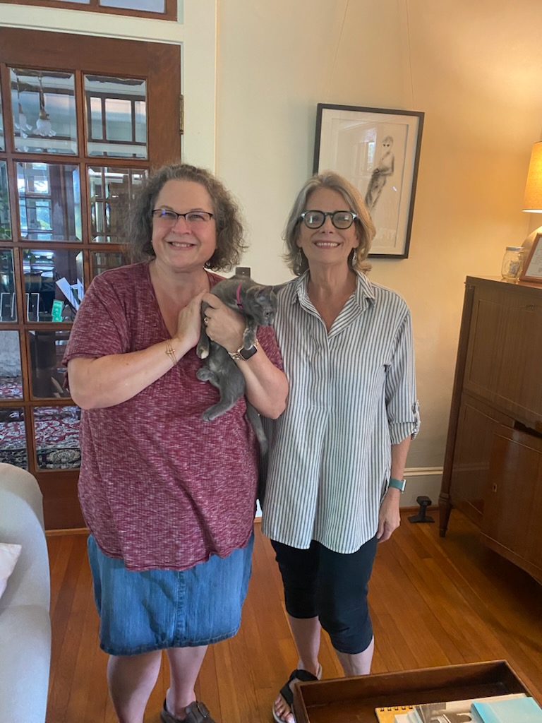 Carrie Hayes (left), with Wild Friday, and Cynzia Sanchez have teamed to form The Maxeys Cat-itude Adjustment Initiative, to help solve the town’s stray cat issue. They’re working with the Lake Oconee Humane Society to catch, spay or neuter the cats, and then return them. (Abigail Hayes/The Oglethorpe Echo)
