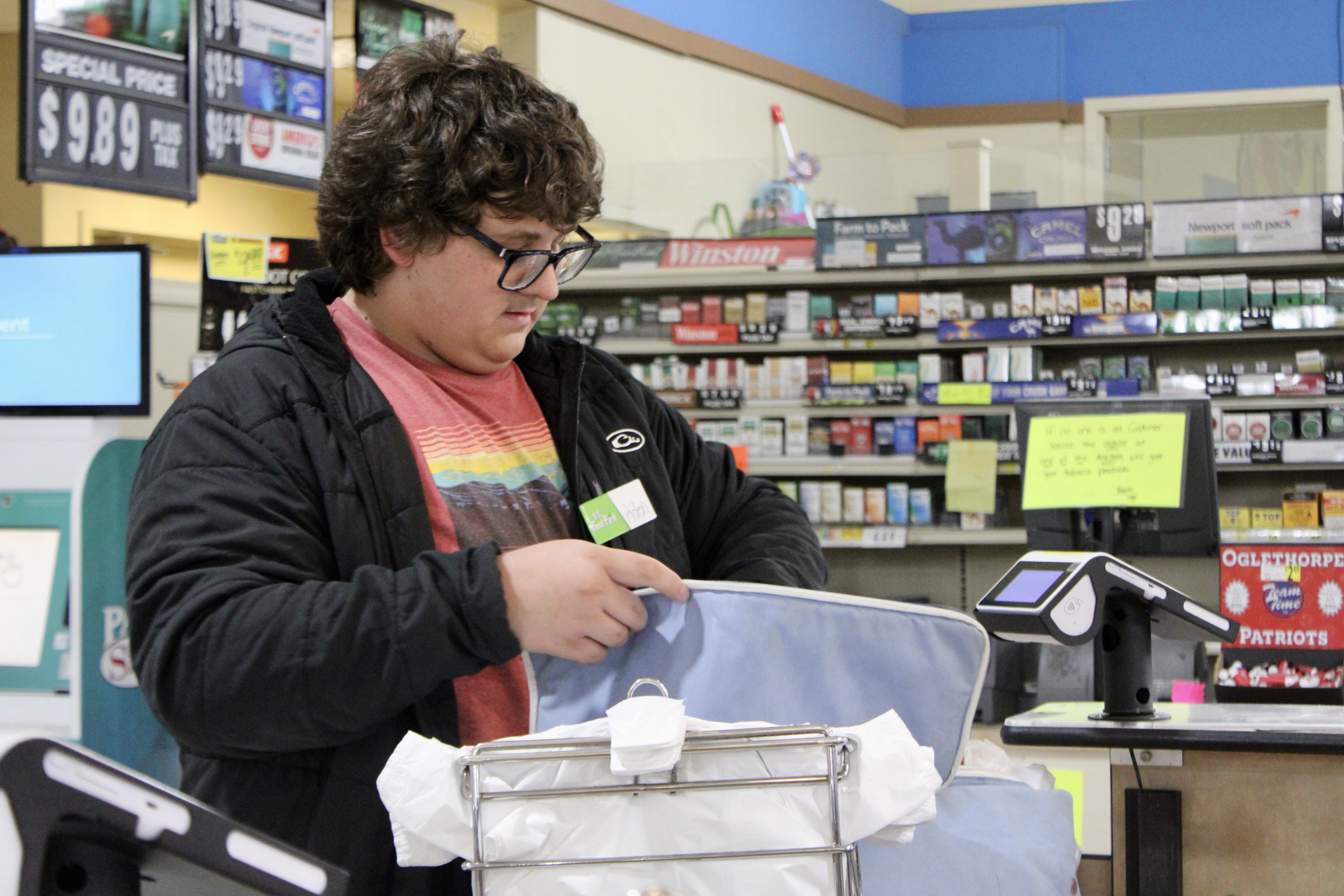 SARAH OWENS/THE OGLETHORPE ECHO Aiden Gabriel, 16, bags groceries at B&T’s Food Fresh Market during his shift as a bagger on Sept. 23. He found a wallet in a shopping cart last month and returned it to the store office, so the owner could claim it.