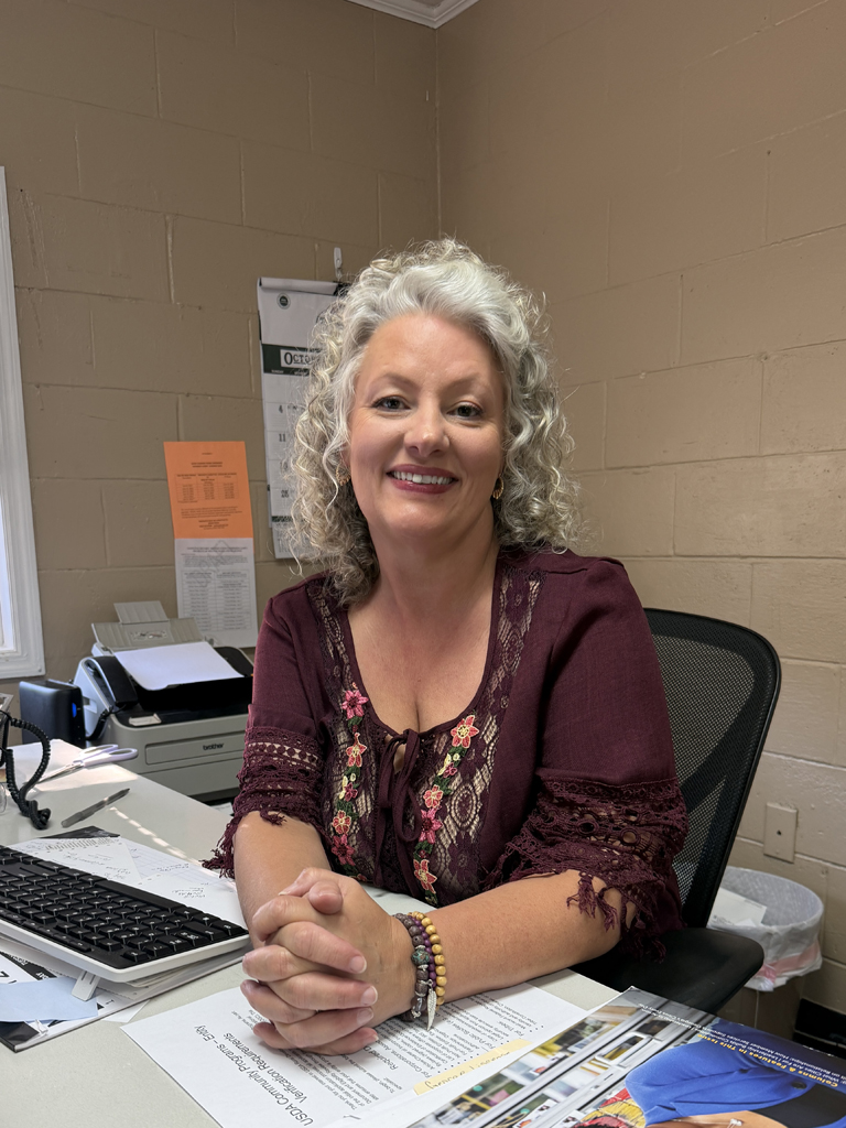 Kim Bradford, City Clerk of Lexington, smiles for a photo while working on the city's water billing on Tuesday, Oct. 6. 