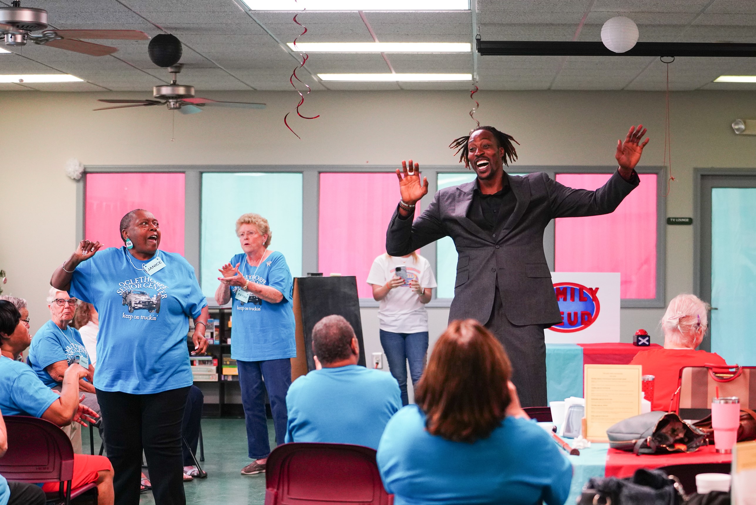 NBA All Star Dwight Howard cheers on the teams on Friday morning. Howard hosted 'Family Feud' at the Oglethorpe Senior Center in Crawford, Georgia. (Sidney Chansamone/The Oglethorpe Echo)