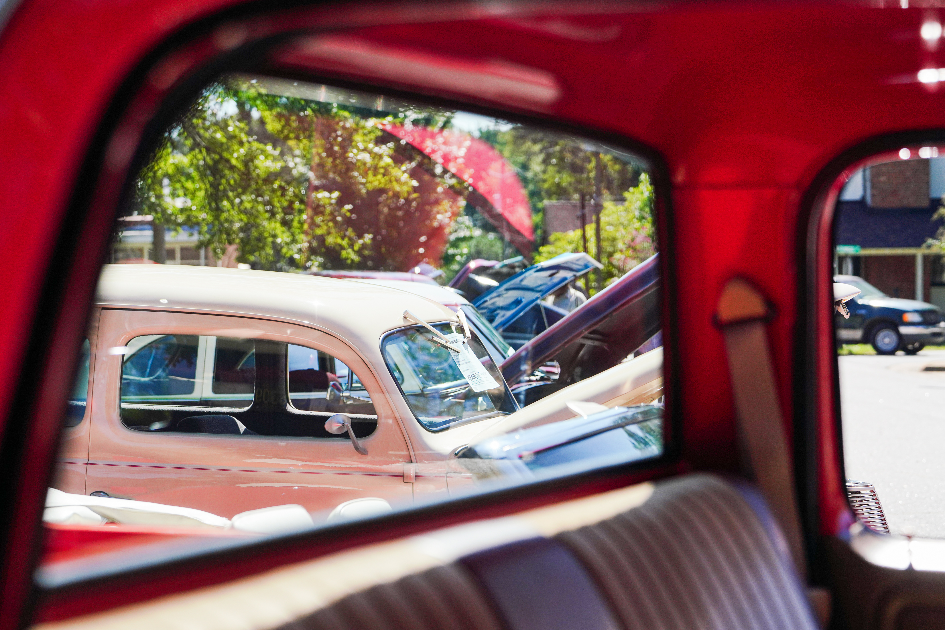 Vintage cars line the street during the annual Firefly Cruise In in downtown Lexington on Sunday. More than 40 vehicles were on display during the event. (Sidney Chansamone/The Oglethorpe Echo)