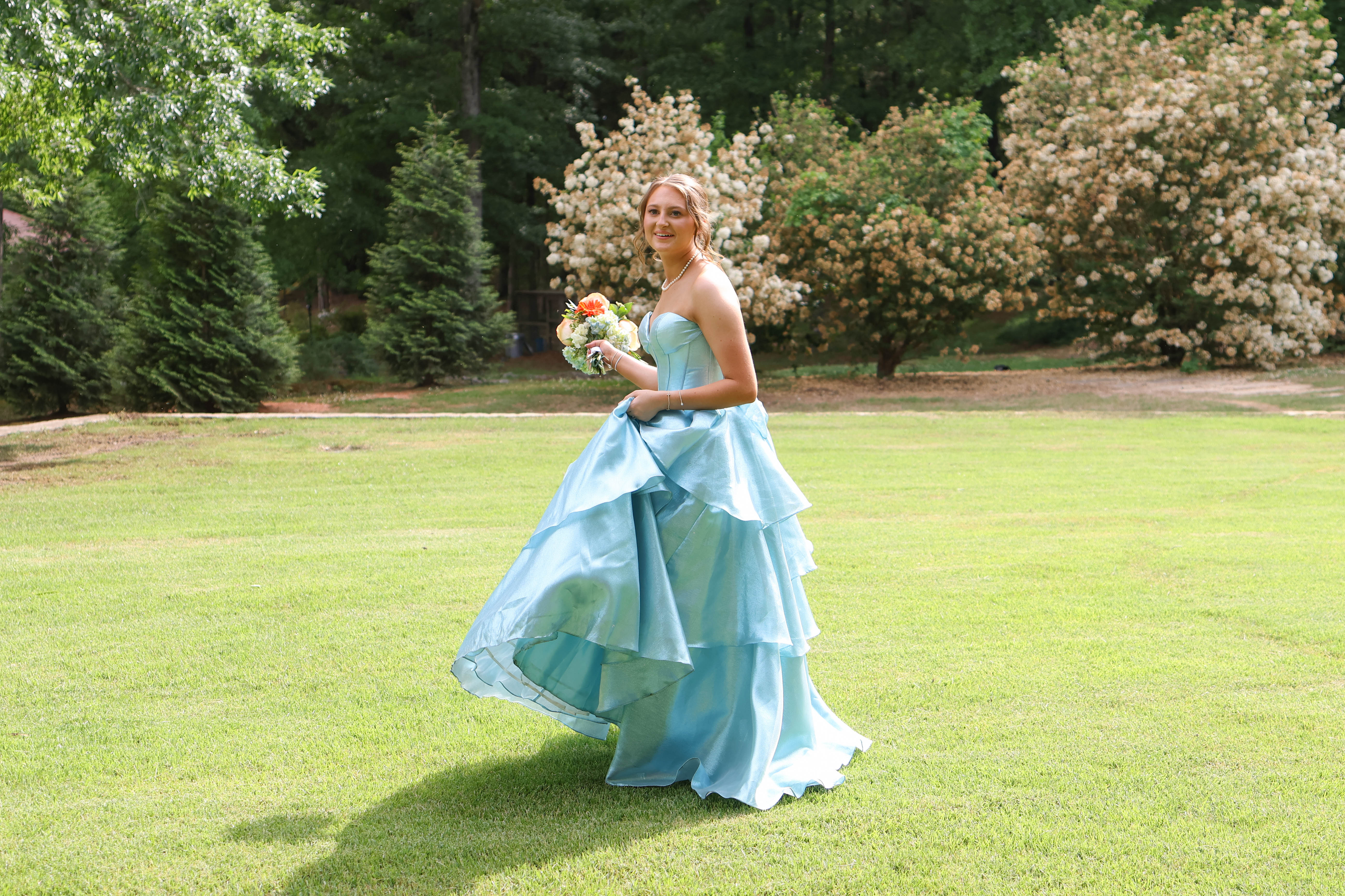 Andee Dellinger walks across the yard for photos before prom in Oglethorpe County on Saturday, April 18, 2026. (Addison Simmons/The Oglethorpe Echo)