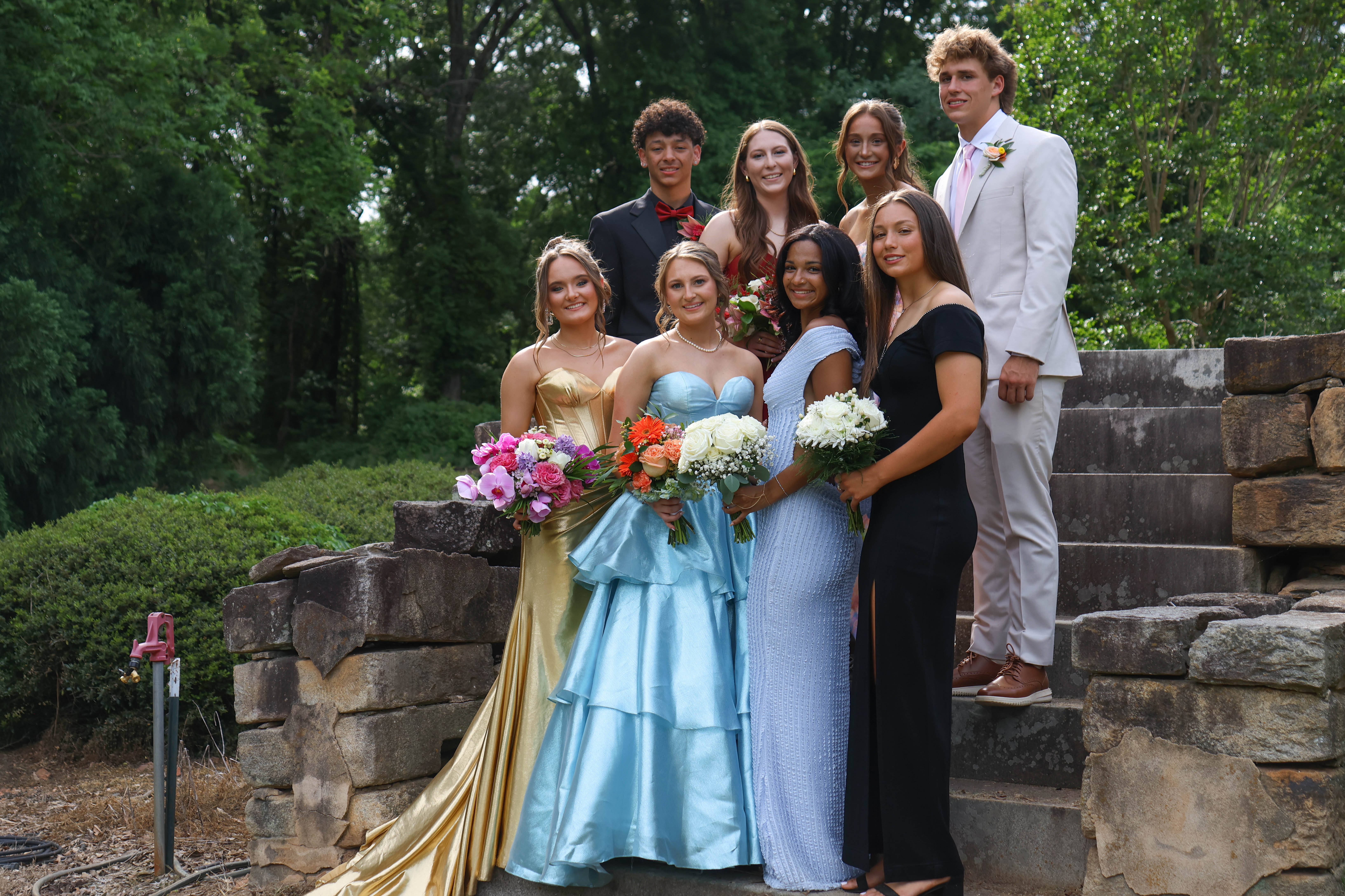Kendon Brown, Carlie Gabriel, Elin Turner, Jackson Tatum, Callie Bridges, Andee Dellinger, Zharia Burgess and Marin Sampson pose for a photo before prom in Oglethorpe County on Saturday, April 18, 2026. (Addison Simmons/The Oglethorpe Echo)