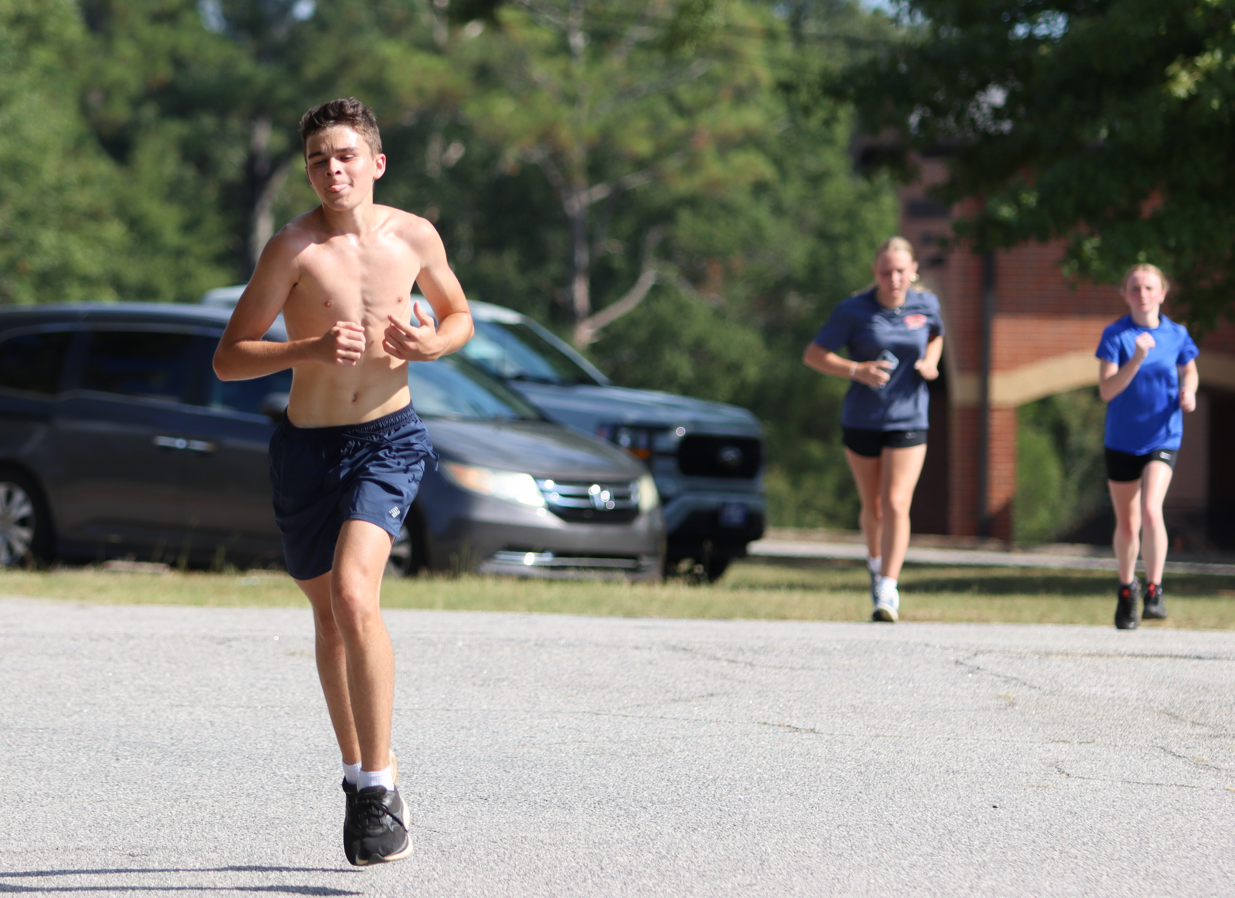 Sophomore Tristan Ruzowicz finishes up his run at the end of cross country practice at OCHS on Friday. Because of how far some athletes live from the school, OCHS is unable to hold morning practices, making athletes have to practice in higher heats. (SYDNEY JARRARD/THE OGLETHORPE ECHO)