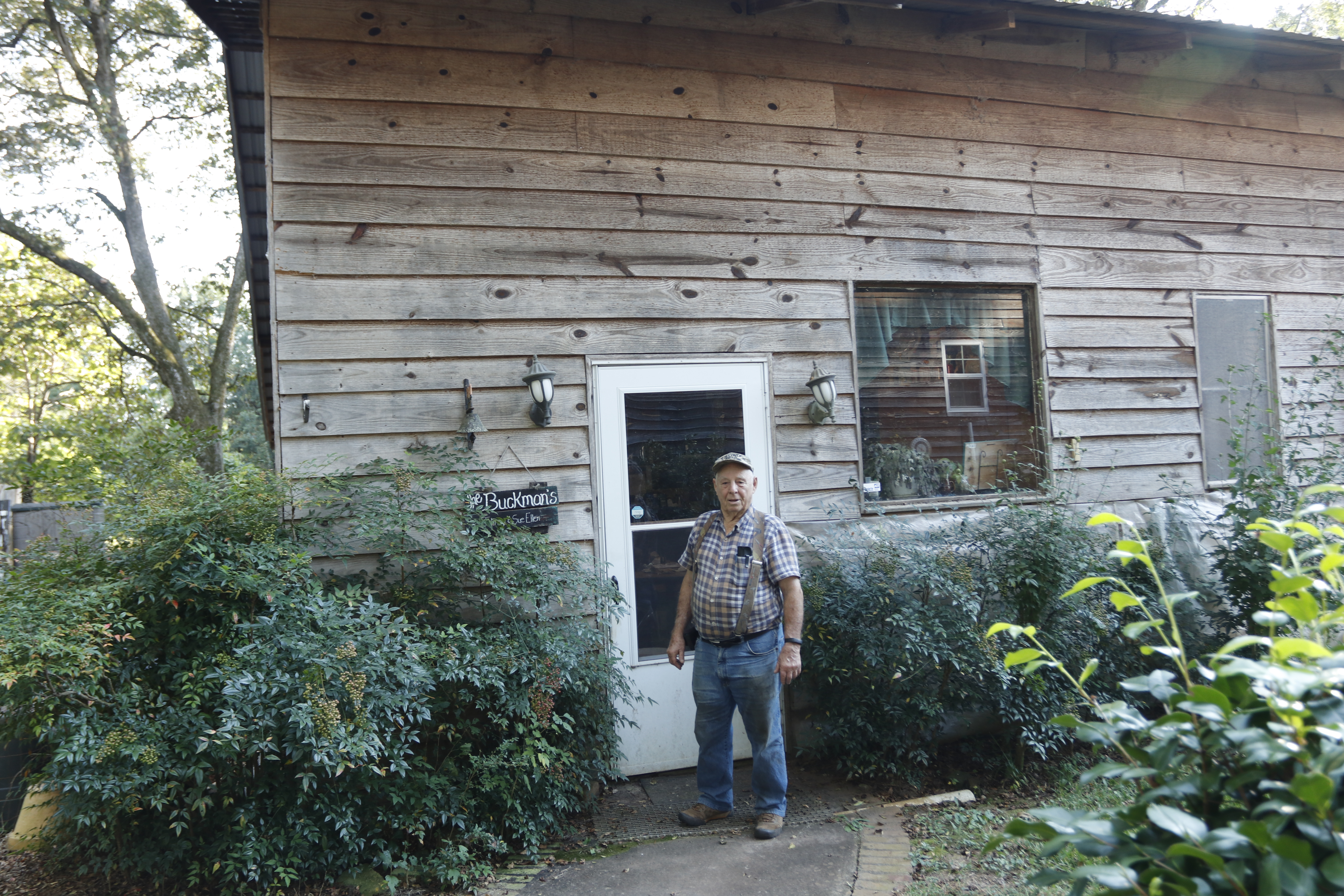 John Buckman, longtime Philomath resident and member of the Philomath Church Preservation Association, stands in front of his backyard shop on Sept. 15, 2025. The Buckman's hosted many fundraisers for the PCPA in this shop. (Photo/Ansley Gavlak)