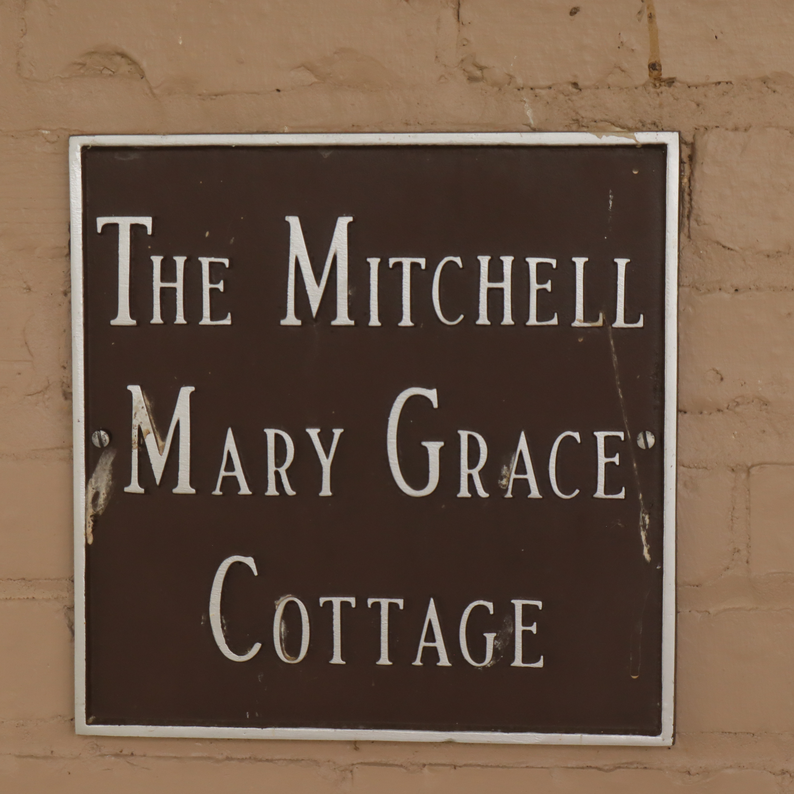 A sign hangs outside of the Mitchell Mary Grace cottage. Ken named it after his daughter Mary Grace. (Photo/Zaire Rushing-Simpson).
