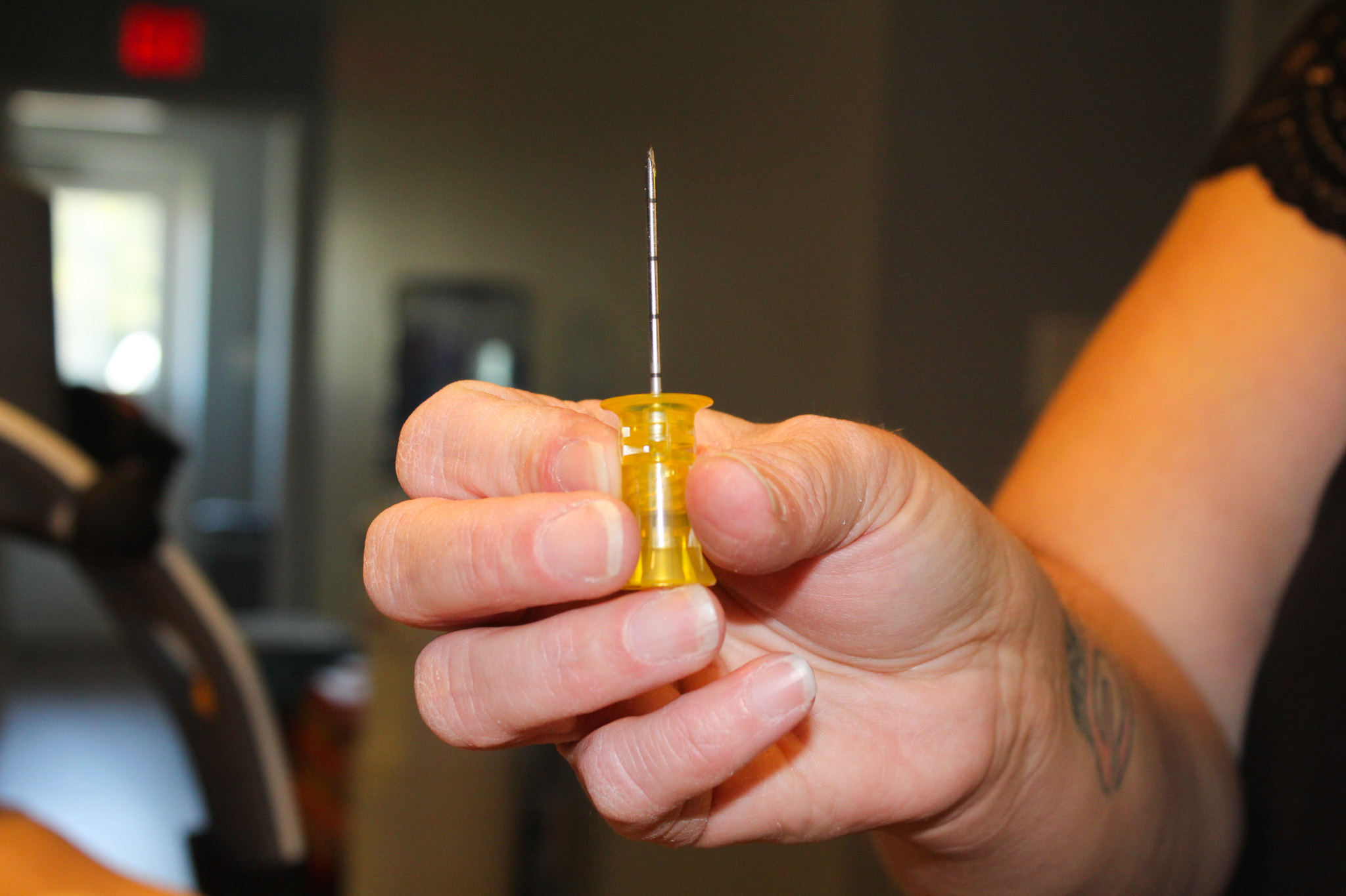 Kristin Gilliam shows off an intraosseous (IO) needle, also known as a bone drill, on Thursday, Sept. 11, in Crawford, Georgia. The needle is used to deliver life-saving medication directly into the bone marrow when traditional IV access is difficult. (Photo/Gabrielle Gruszynski)