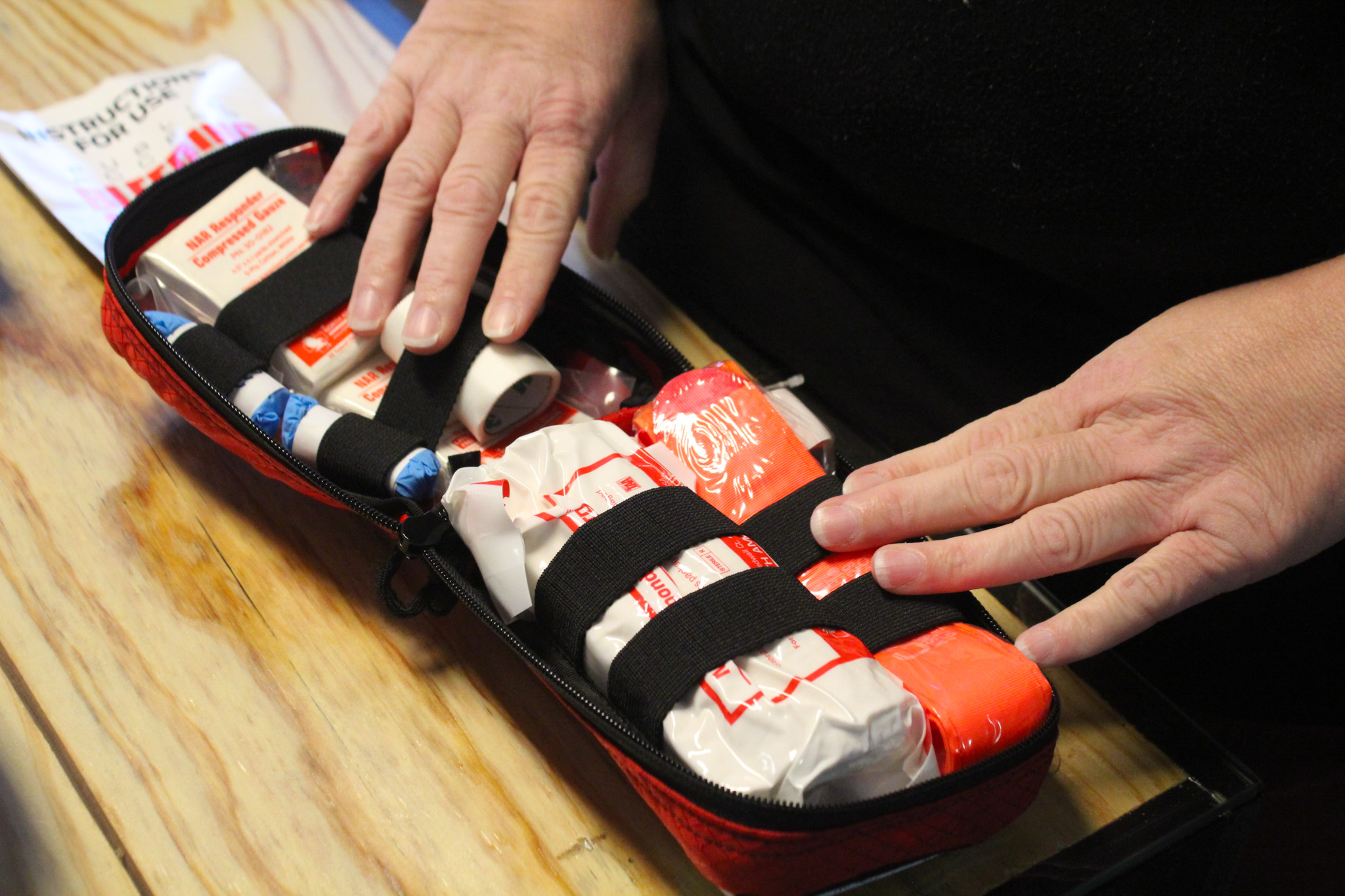 Kristin Gilliam opens a bleeding control kit on Thursday, Sept. 11, in Crawford, Georgia. The kits are used in EMS to quickly stop severe bleeding and stabilize patients before they reach a hospital. (Photo/Gabrielle Gruszynski)