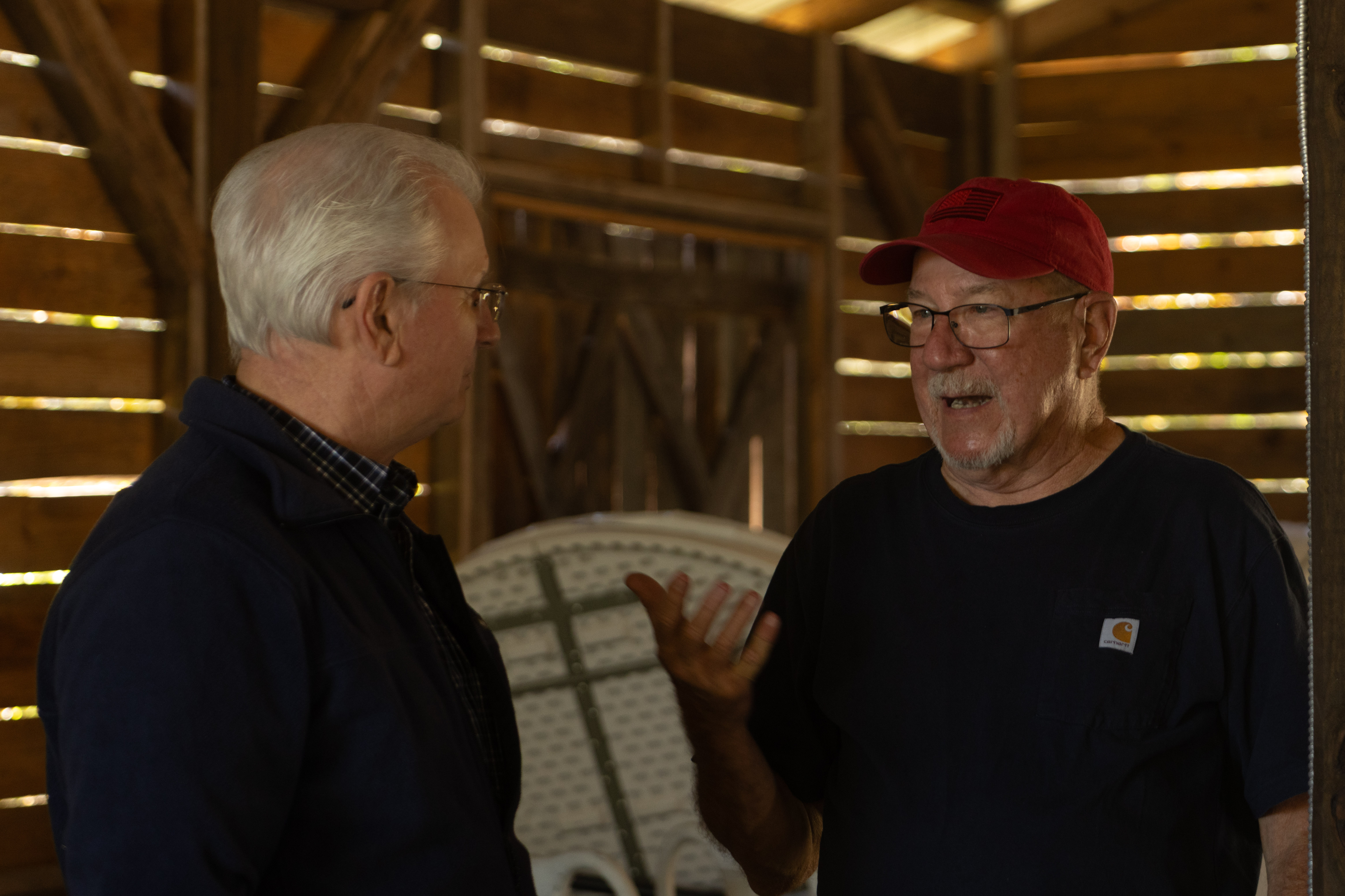 Brent Sherrer (left) talks with Curtis Arthur at the EMS 50th anniversary celebration on Friday, Oct. 23, 2026. Sherrer is a former director of EMS, and Arthur is a paramedic. (SARAH ROPER/THE OGLETHORPE ECHO)