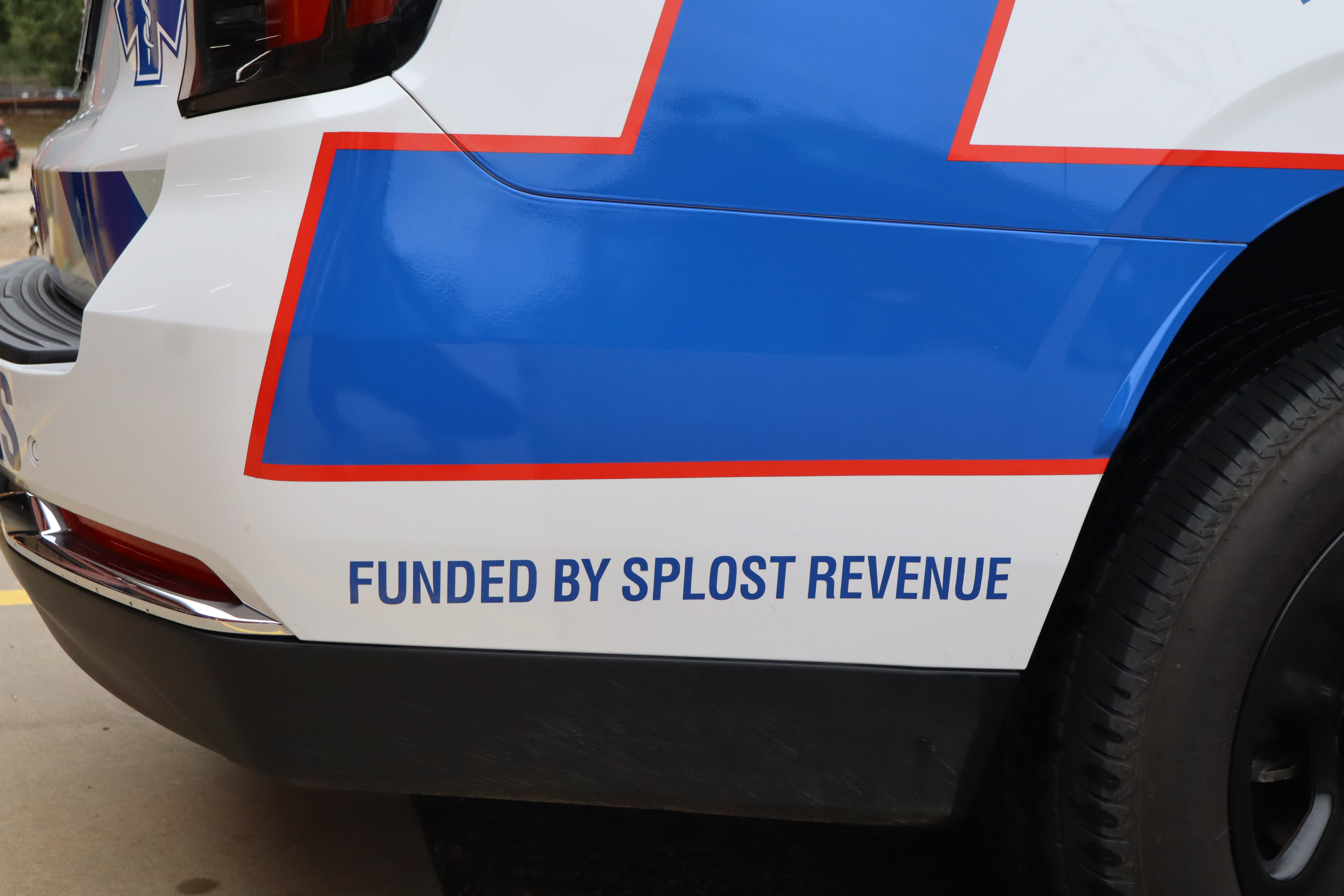 Decals reading “Funded by SPLOST Revenue” are on the rear panel of an EMS quick response vehicle. The 2025 SUVs were purchased using SPLOST funds.
