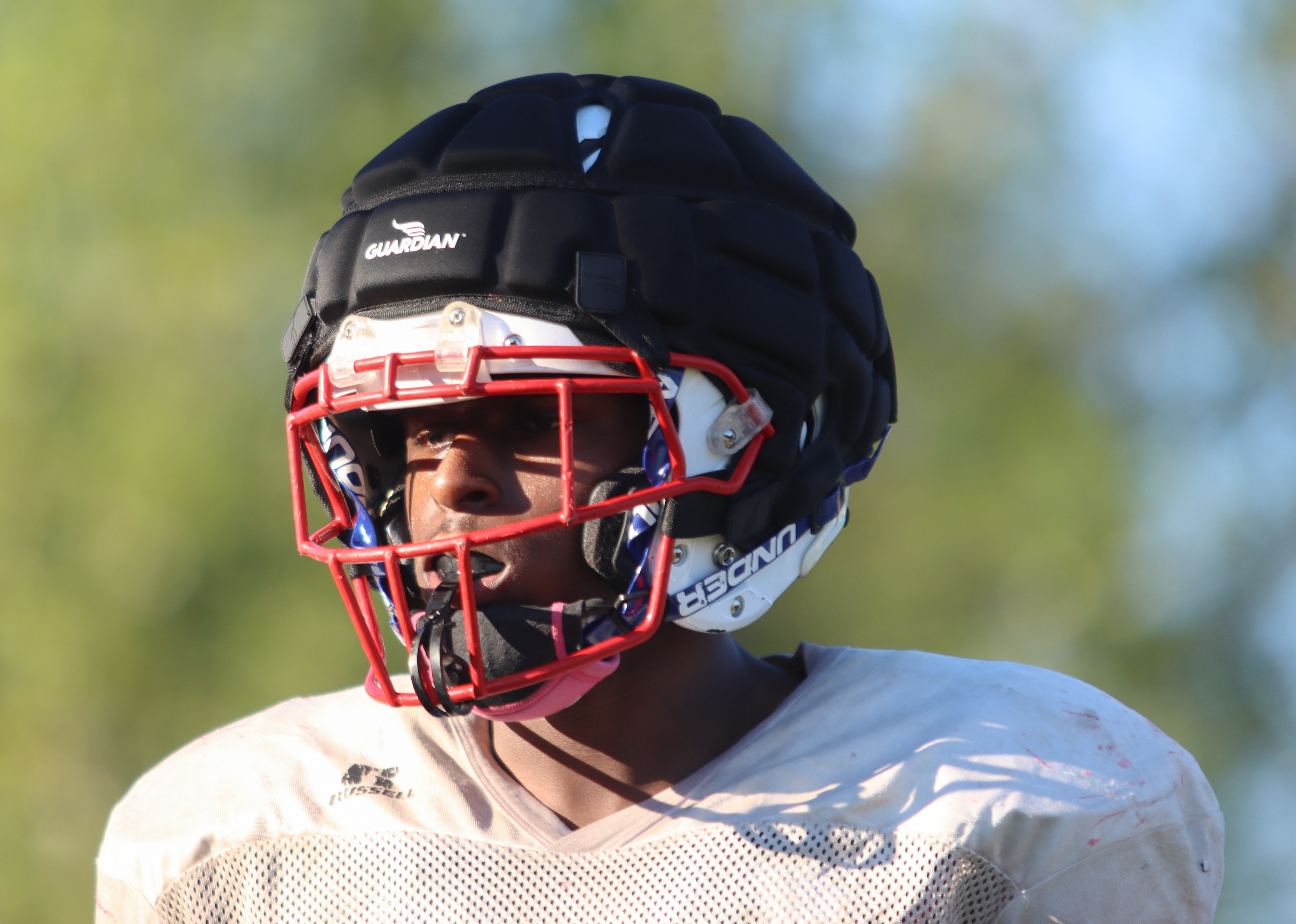 Sophomore Josh Hull practices with the Oglethorpe County football team this season. Hull sustained a concussion during practice, and his coaches require him to wear the Guardian Cap to help reduce a head injury. (Sydney Jarrard/The Oglethorpe Echo)