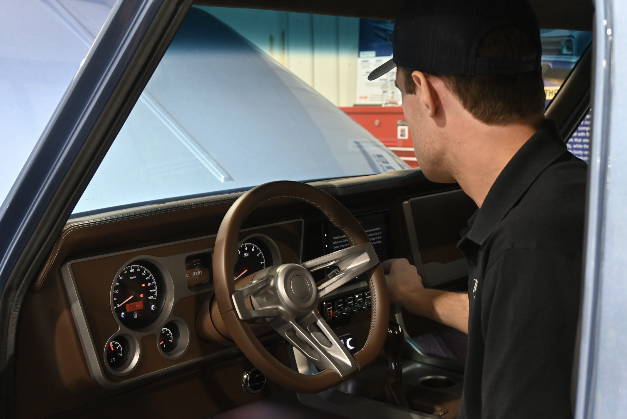 Thomas Dickerson starts his rebuilt 1967 Chevrolet C-10 at the Thomas Performance Engineering shop in Lexington last week. He installed a push-button start and a GPS in the nearly 60-year-old truck. (Photo/Neva Drane)