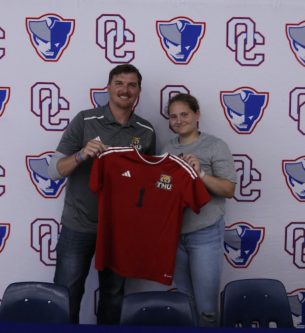 Anna Adams poses with Truett McConnell's head assistant women's soccer coach Jonathan Britt. Truett McConnell competes in the National Association of Intercollegiate Athletics. (Torin Smith/The Oglethorpe Echo)