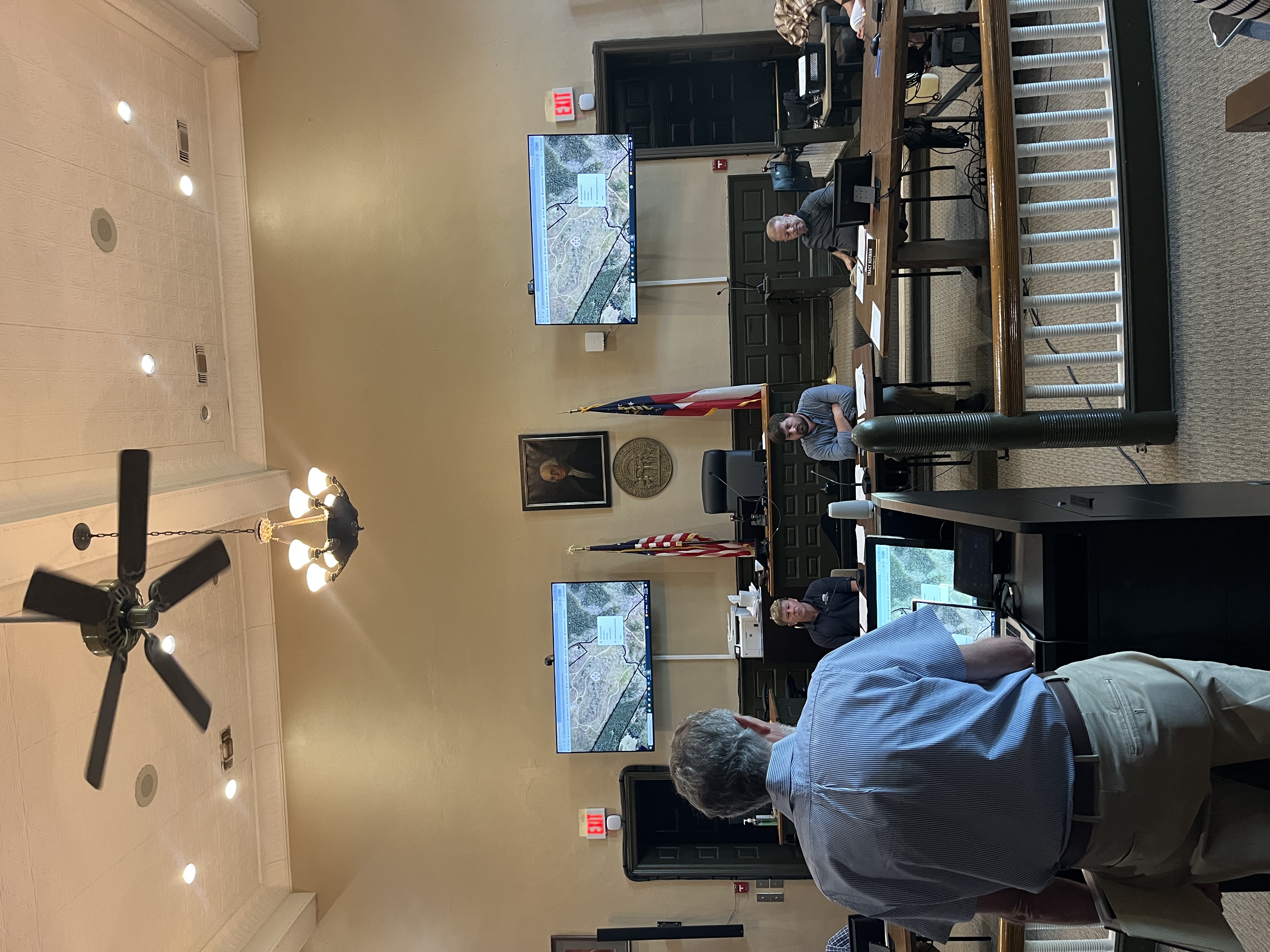 Tom Gresham discusses a possible expansion to the Digital Atlas Project with members of the Oglethorpe County Board of Commissioners on Monday at the courthouse. Gresham was able to use the multimedia screens to show the project. (MAIA CAPUANO/THE OGLETHORPE ECHO)