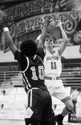 Luke McGarity, who finished with six points, takes a shot in Oglethorpe County’s 60-48 loss to Glenn Hills on Tuesday. (Sarah White/The Oglethorpe Echo)