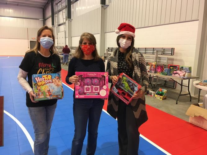 Volunteers for the Community Christmas charitable group post for a photo at an event in 2020. (Submitted Photo)