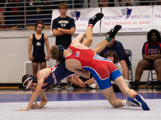 Landon Quarles wrestles Putnam County's Scotty Ford. (Photo/Sarah White)