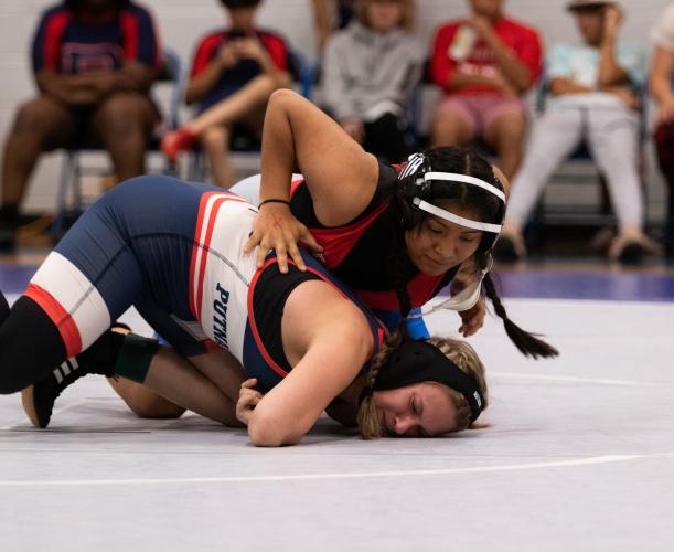 Chelsea Durie wrestles Alyssa Irvin of Putnam County. Oglethorpe County High School defeated Putnam 72-18. (Photo/Sarah White)
