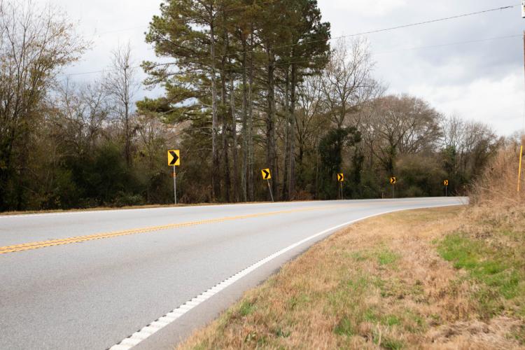 Cherokee Corner is marked by signs showing the direction of the curve. (Photo/Sarah White)