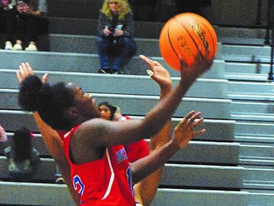 Aariana Bell goes in for a layup in the Oglethorpe County girls' 59-15 victory over West Hall. (Photo/Sarah White)