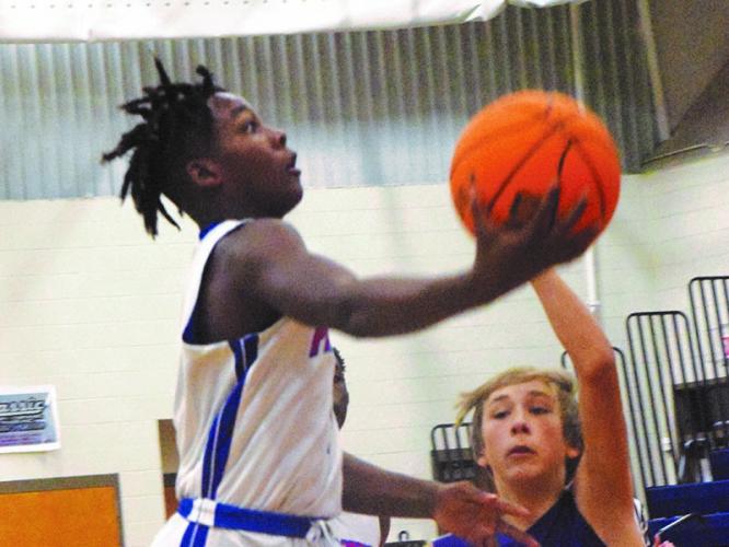 Eighth-grader Payton Prince drives to the basket in the Oglethorpe County Middle School boys' game against Athens Christian. (Photo/Ralph Maxwell)