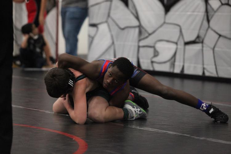 OCMS wrestler Paris Crowder gains the upper hand on his opponent on the way to winning his weight class in the Redskin Rumble on Saturday. (Photo/Sarah White)