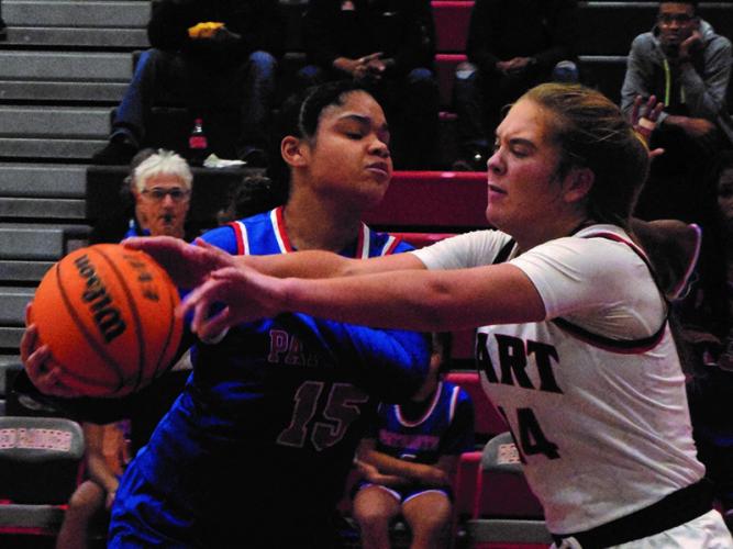 Amber Watkins, who scored 15 points, keeps the ball away from a defender. (Submitted Photo/Ralph Maxwell)