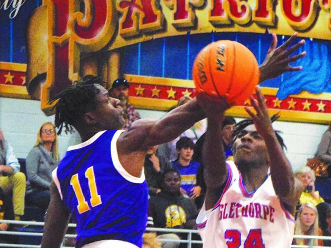 Oglethorpe County's Jaelin Lumpkin (No. 24) reaches for a loose ball in the Patriots' 57-47 win over Athens Christian. (Photo/Ralph Maxwell)