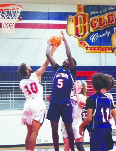 Nick Huff (5) shoots over Henry Johnson (20) during the Oglethorpe County basketball team's Super Saturday fundraiser on Nov. 13. The Varsity Blue team played the Varsity White team in a scrimmage, and other activities included 3-point, hot-shot and dunk competitions. (Photo/Ralph Maxwell Jr.)