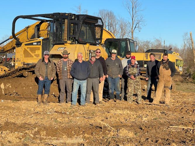 David Whitehead (from left), Larry Johnson, Tony Lastinger, Randy Ray, David Ash, Dennis Moon, Colt Hart, Bruce Moon, Mark Wiskow and Matt Ring were among the group of area men to help tornado survivors. (Submitted Photo)