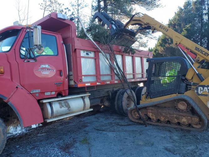 Crews from Oglethorpe County Public Works, including Tommy Wood in the dump truck and Logan Gabriel in the loader, clear debris from Brown’s Chapel Road. (Submitted Photo)