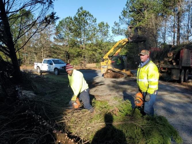 Tyrone Henson and Billy Shellnut, with Oglethorpe County Public Works, use chainsaws to help clear Brown’s Chapel Road. (Submitted Photo)