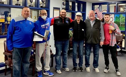 A group of Oglethorpe County High School coaches showed their support of bookkeeper Tina Woods by shaving their heads while she undergoes chemotherapy. Coaches Steven Irwin (from left), Tim Stoudenmire, Kris Patel, Dale Blalock and James Moree posed with Woods (fourth from left). (Submitted Photo)