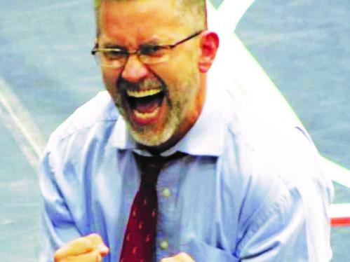 Oglethorpe Country wrestling coach Tim Stoudenmire is exuberant as his team wins the Class AA wrestling title in February. (Photo/The Oglethorpe Echo)