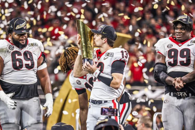 Stetson Bennett (top) helped lead Georgia to a 33-18 victory over Alabama to win the national championship on Monday night. (Mackenzie Miles/UGA Sports)