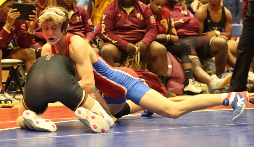 Austin Kort gains the upper hand against his opponent at the Class AA team dual championship. (Donny Faust/Submitted Photo)