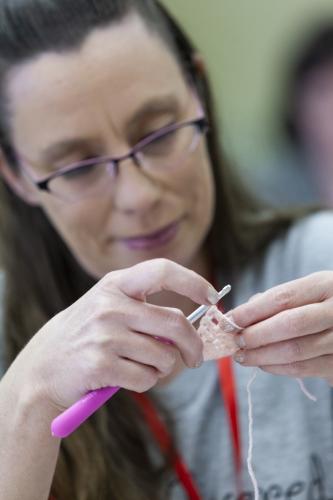 (Sydney Fordice/Oglethorpe Echo) Jennifer Spoor works on a crochet piece during a recent Covered With Love meeting at Lexington Baptist Church. The group of women gathers to crochet afghans to donate to various local groups every year.