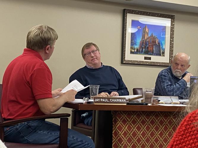 Chairman Jay Paul (from left) and commissioners Andy Saxon and  David Clark discuss the pros and cons of the new radio systems in a meeting this week. (Kate Hoffman/The Oglethorpe Echo)