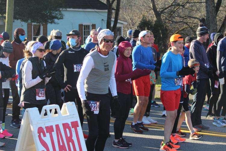 Runners line up at the start line at the Winterville Civitan Snowflake 10k on Jan. 29. There were 185 in-person participants in the race, which is the first race in the Firefly Trail Race Series. The other races are the Maxeys Model Mile 5k, Crawford Restoration Labor Day Run 5k and Union Point J3 5k, scheduled for later this year. (Mackenzie Tanner/The Oglethorpe Echo)