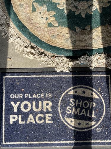Visitors to Lexington Antique Mall are greeted by this welcome mat. Its mission is to remind customers to shop from local and small businesses. (Colt Yeargin/Oglethorpe Echo)