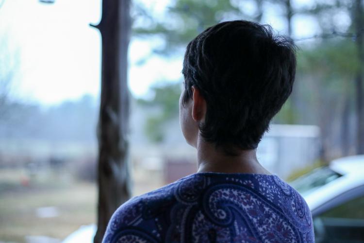 Laura Pallas gazes over Buffalo Creek Berry Farms as her husband, Cameron Phillips, tends to their animals. They started the farm in 2017 with the hopes of it becoming a sustainable and holistic farm. (Aly Hertzog/The Oglethorpe Echo)