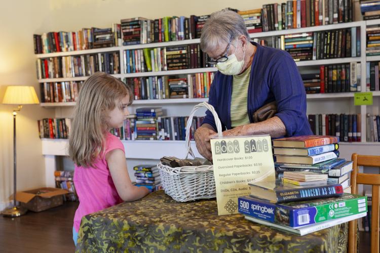 Customers look through CDs at the Seed Swap and One-Day Book Sale, which is hosted by Friends of the Oglethorpe County Library on the first Saturday of every month. (Sydney Fordice/The Oglethorpe Echo)