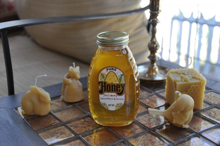 Homemade honey and beeswax candles are sold at the Oglethorpe County Bee Club’s website and at festival booths. (Elena Westbury/The Oglethorpe Echo)