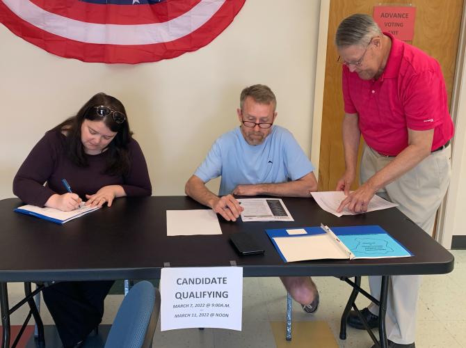 Rebecca Soto (left), the incumbent for the District 5 Board of Education seat, qualifies on Monday, the first day for qualifying for general primary. Darrius Tompkins (center) qualified for the District 1 Board of Commissioners seat as the Board of Elections’ Steve McCannon (right) looks on. Qualifying ends at noon on Friday, March 11. (Submitted Photo)