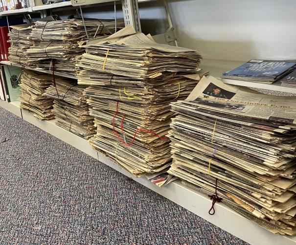 Old and brittle newspaper editions of The Oglethorpe Echo sit on shelves in the front of the Oglethorpe County Library. Many pages are ripped out and torn up from use. (Submitted Photo)