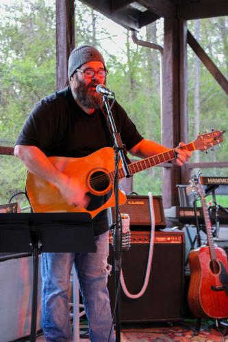 Adam Payne sings an original song at the new location of Oglethorpe Fresh. His performance was met with applause. Shannon Moran/The Oglethorpe Echo