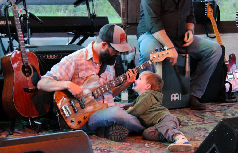 Jay Rodgers, member of the band Diet Dangfly, plays the guitar while his son watches. The Oglethorpe Fresh Concert Series prides itself on being family friendly. Shannon Moran/The Oglethorpe Echo
