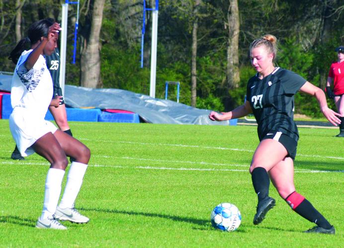 Maddie Williams (right) scored two goals in Oglethorpe County’s 10-0 victory over Glenn Hills to wrap up an undefeated region schedule. (Ralph Maxwell/The Oglethorpe Echo)